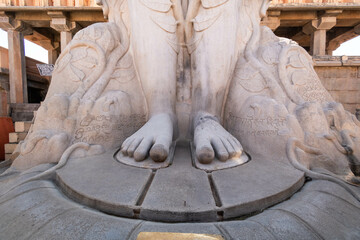 The sculpted feet of the ancient statue of Gommateshwara Bahubali on top of the VIndhagiri hill in...