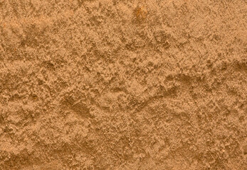 close up on brown cement wall. sunny day