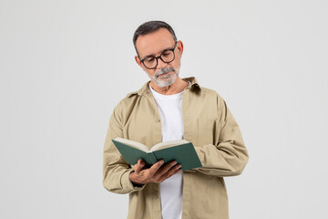 Man With Beard and Glasses Reading a Book