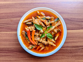 claw spicy or claw firecrackers in a bowl with a spicy and savory taste on a wooden background