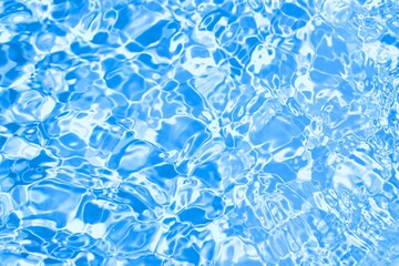 Shiny blue rippled water surface background