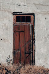old broken wooden door of a destroyed house in Ukraine