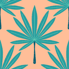 Seamless pattern of a teal palm leaf on a peach background