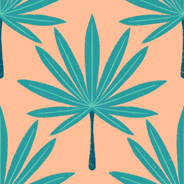 Seamless pattern of a teal palm leaf on a peach background
