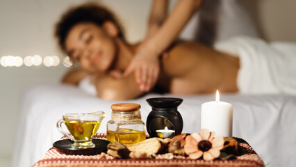 Relaxing spa therapy with african american woman