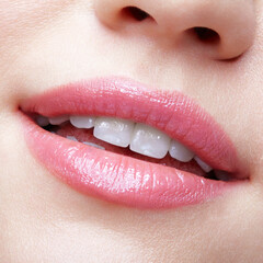 Close-up macro portrait of female part of face. Human woman lips with day beauty makeup