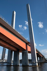 Bolte Bridge in Melbourne, Victoria, Australia. The large twin cantilever road bridge spans the Yarra River in the Docklands precinct to the west of the Melbourne CBD