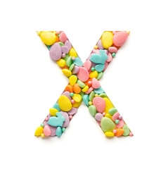 Capital letter is made of candies in the shape of Easter eggs on a white background.