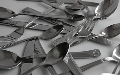 Closeup View Of Tarnished Steel Spoons, Forks And Table Knives. Photo For Cutlery Setting Illustration 
 - obrazy, fototapety, plakaty