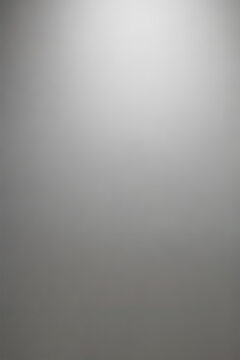 High-resolution gray gradient background with a smooth light effect, ideal for studio photography or as an abstract backdrop.