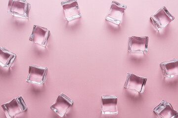 Ice cubes on pastel pink background. Minimal summer drink concep