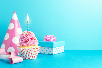 Colorful celebration background with various party decoration and cupcake. Minimal party concept.