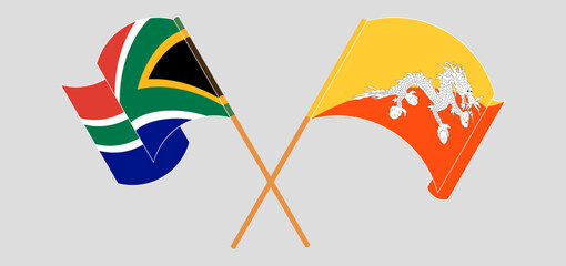 Crossed and waving flags of South Africa and Bhutan