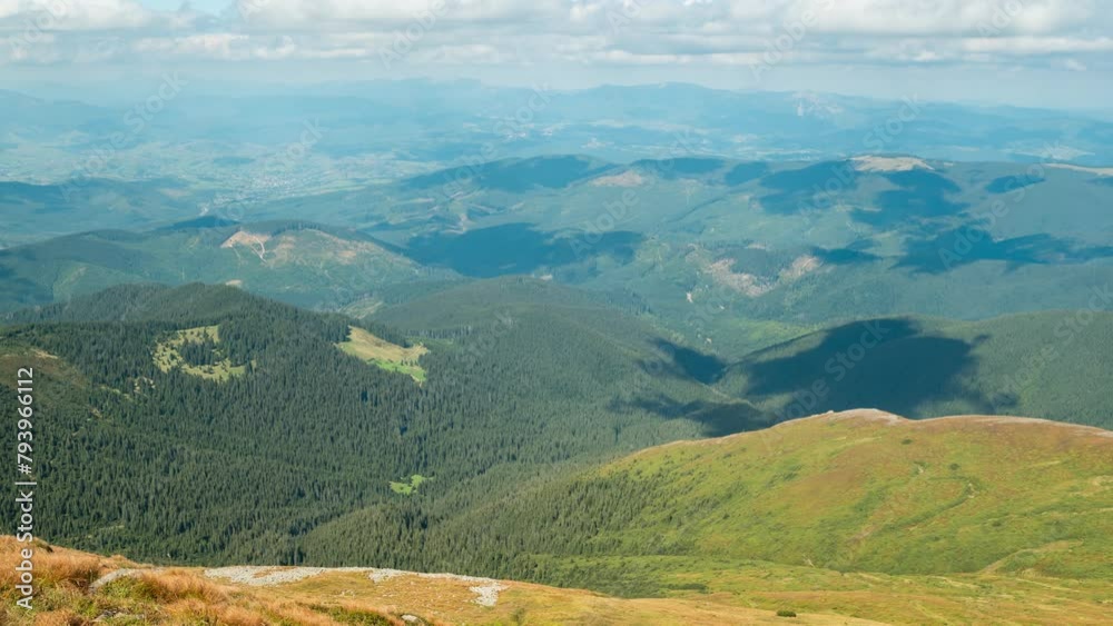 Wall mural Time lapse video of shade of clouds flowing through mountain forests. Time lapse view from Hoverla mountain - highest mountain in Ukraine