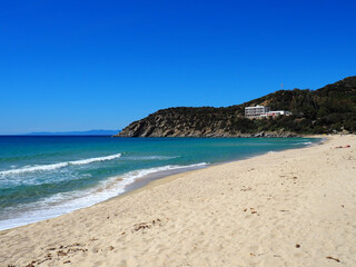 Beautiful solanas beach with turquoise water under blue sky and white sand.