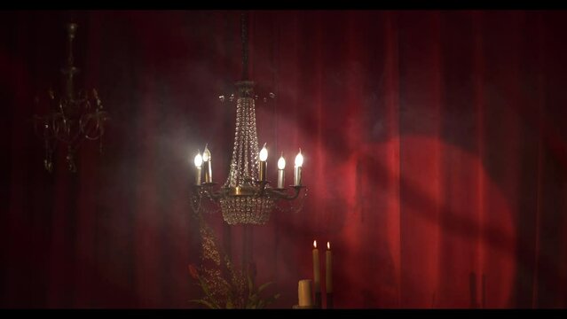 A beautiful ornate theater stage. red curtains in the spotlight.