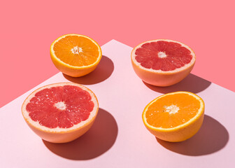 Creative fruit composition on pink background with hard shadows. Summer minimal concept.