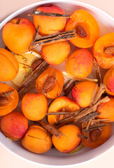 Fresh peaches for rosted and make an easy summer dessert with saffron, cinnamon, almonds, lemon and sugar. Light summer desserts based on fruits. Healthy eating in summer