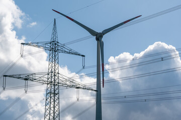 High voltage pole and turbine of a wind power plant. Ecological energy production.