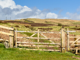 Gate or wooden fence with dirt foot path, track leading to the Scottish highlands, Kilpatrick...