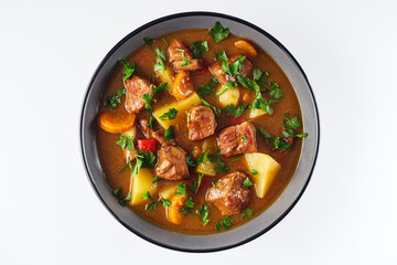 fragrant thick goulash soup on a white background