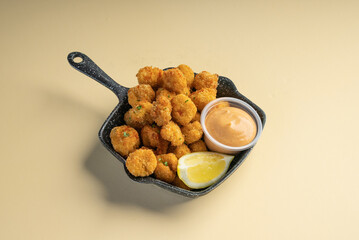 Crunchy chicken popcorn served with peri peri mayo sauce