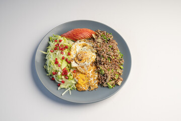 Keto diet menu, Egg with red rice, apple, pomegranate and lettuce
