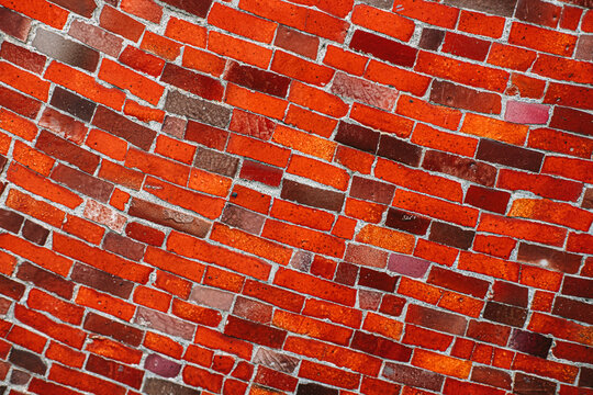 Textured Red and Pink Brick mosaic Wall Close-up View