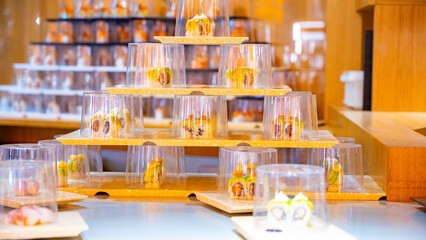 Japanese cuisine, modern restaurant with sushi, sashimi, other Japanese dishes served on moving belt across restaurant, self-service lunch cafe