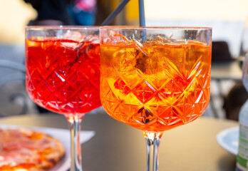 Aperol and Campari Spritz orange bitter long drink cocktails made with liqueur, prosecco sparkling...