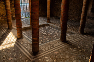 Ancient house interior in Pompei, Italy. Stone columns.