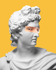 Antique statue head with male eyes photo element on yellow background. Modern design. Contemporary colorful art collage. Suspicious look. Concept of creative vision, emotions.