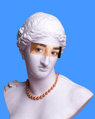Antique statue plaster bust with necklace and female eyes photo element on blue background. Modern design. Contemporary colorful art collage. Concept of creative vision, emotions.