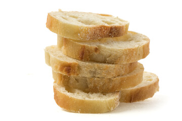 extreme closeup of a stack of French bread slices isolated on white