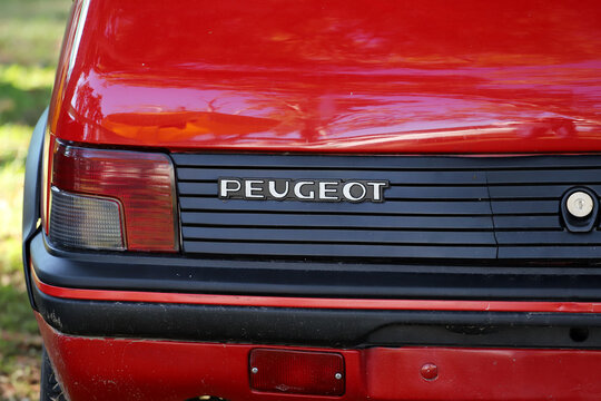 Peugeot 205 CTI car detail. Small sports car. Red car. Outdoor exhibition of old classic cars.