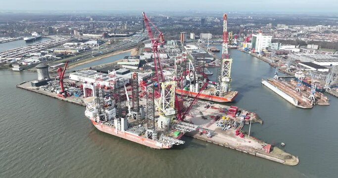 Aerial drone view of a company specializing in heavy lifting, with a terminal in the port of Schiedam, The Netherlands offshore maintenance and maritime works