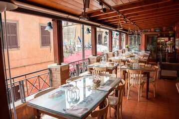 Open terrace restaurant in summer in Italy - 794050782