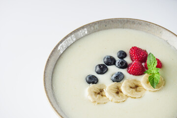 sweet semolina with berries on a white background