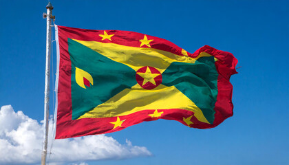 Die Fahne von Grenada, Karibik, flattert im Wind, isoliert, gegen den blauen Himmel