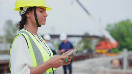 Team contractor or builder walking examining and checking project development house. Group of machine technicians architect or engineer inspection and planning construction site, industry concept.