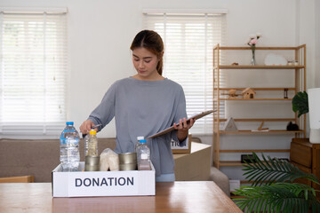 Woman with charity box. volunteer at assistance center. Charity, donation, and volunteering concept