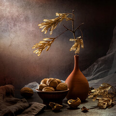 Modern still life with a dry maple branch in a clay vase and walnuts on a dark background