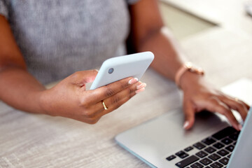 Hands, business and woman with laptop, smartphone and typing with connection, internet and hotspot. Person, closeup and employee at desk, computer and cellphone with social media, app and network
