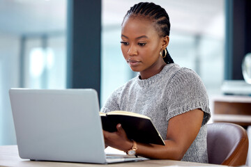 Laptop, reading and black woman in office with notebook, networking and website for online...