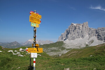 Hiking Sign to SAC Carschina Switzerland Wanderer Season Summer with little Snow