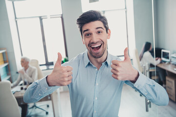 Photo of confident agent man make thumb up symbol advertise offer in office