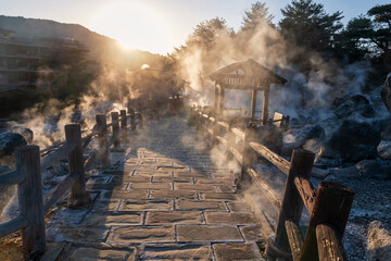 Unzen Hell Jigoku hot springs with heavy steam at sunset, Nagasaki