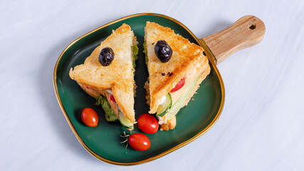 Club sandwich sliced on tray