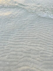 Transparent sea water, natural sea surface background, sea water, sand bottom