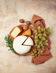 Georgian cheese, Imeretian and smoked suluguni, grapes, nuts, on a cutting board, Georgian cuisine, no people,